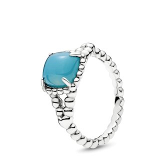 Silver ring with scuba blue crystal